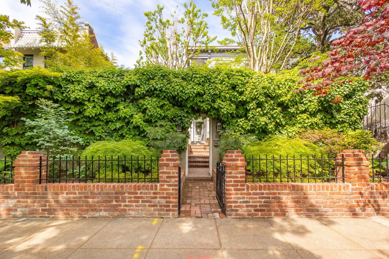 Real estate investors examine property market trends at a conference table.