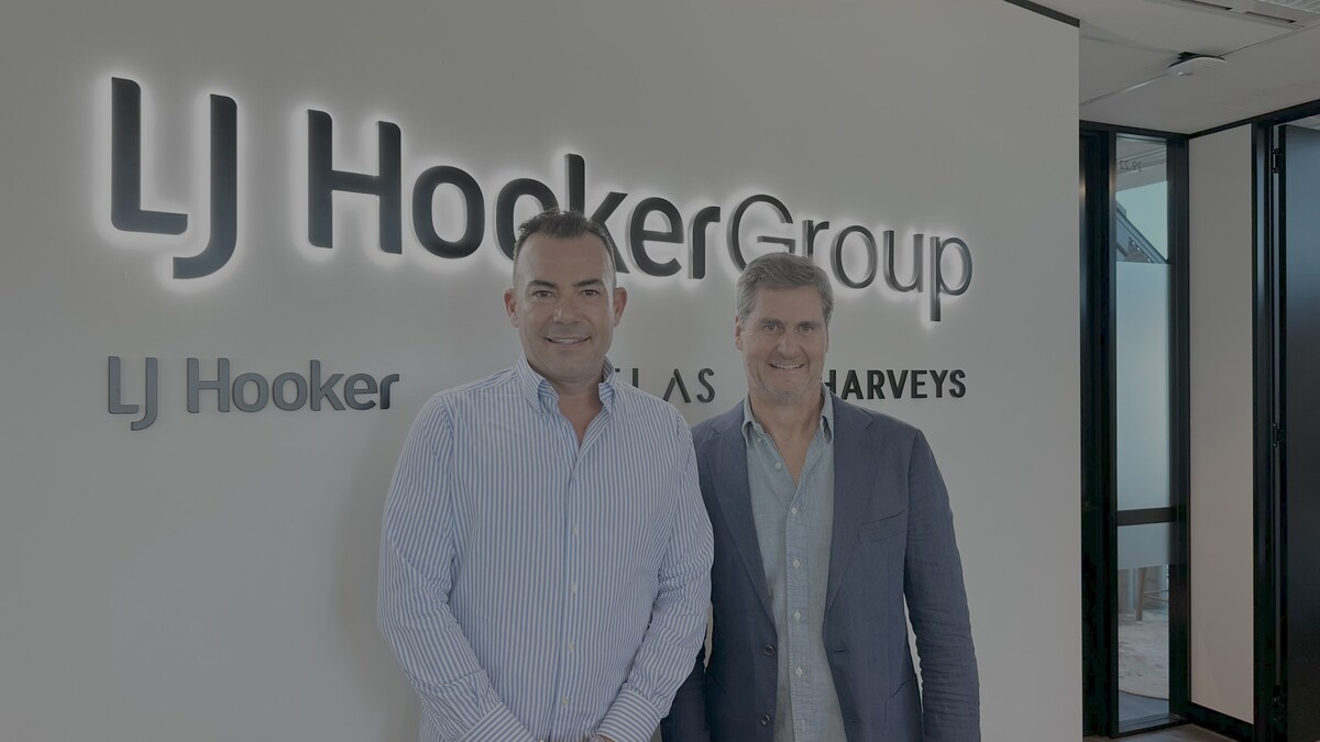 Properti and LJ Hooker executives collaborate on innovative real estate marketing solutions globally.