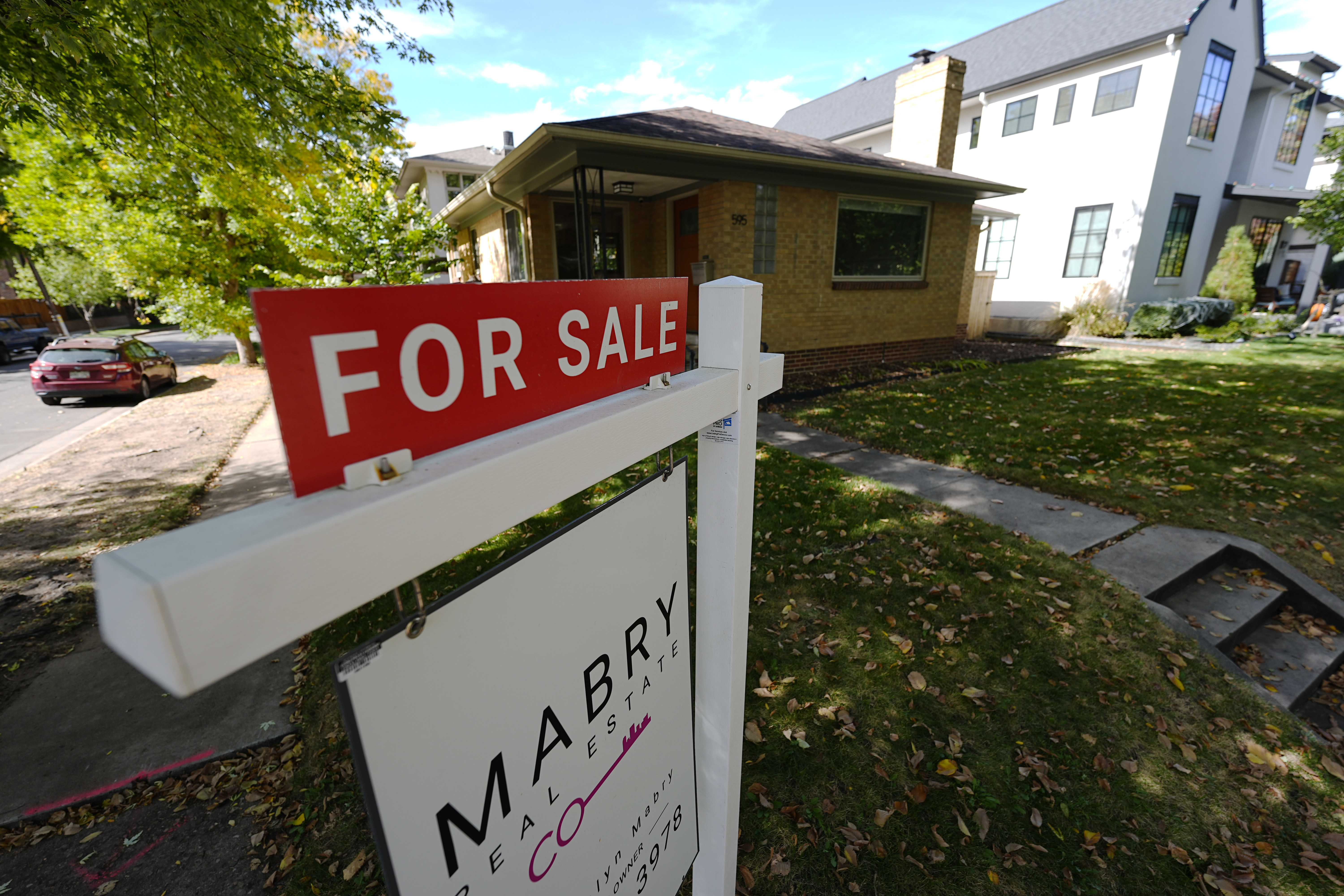 Housing market decline: empty homes amidst rising costs and stagnant consumer sales.