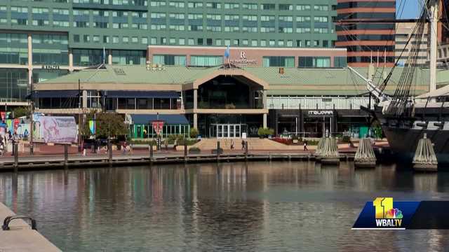 Baltimore residents protest outside MCB headquarters against real estate development deal.