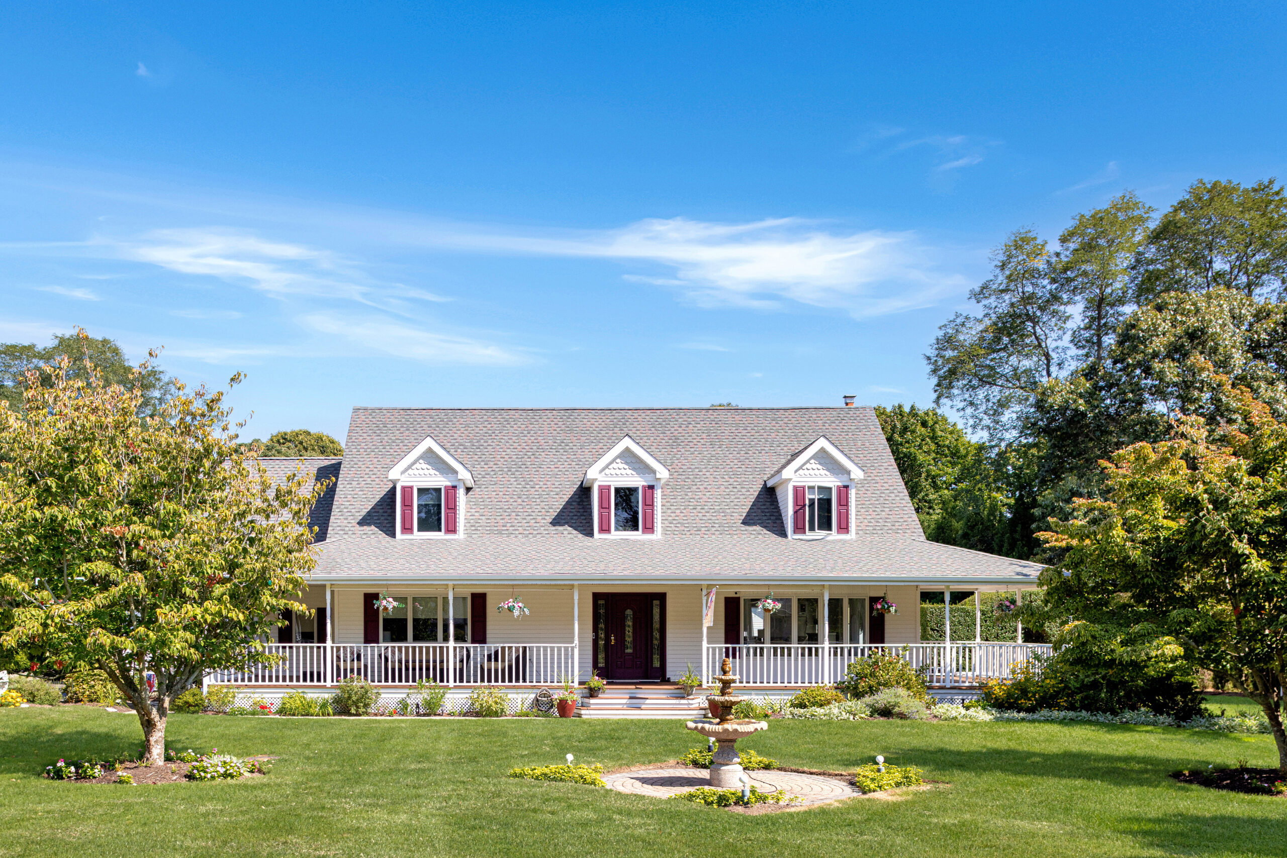 Rustic farmhouse on private acres in Mattituck, Long Island, serene countryside setting.