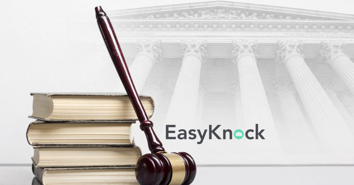 EasyKnock executives celebrate victory in $153,000 arbitration case at New York headquarters.