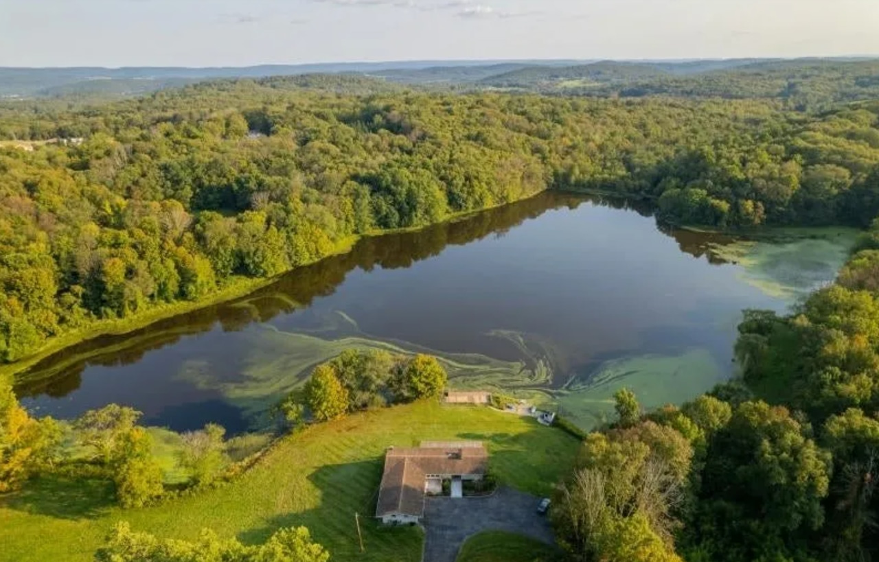 Private lakefront estate in New Jersey offers serene waterfront scenery and luxury living.