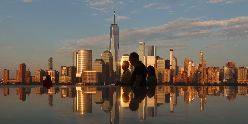 Blackstone President speaks at podium in New York City, discussing commercial real estate.