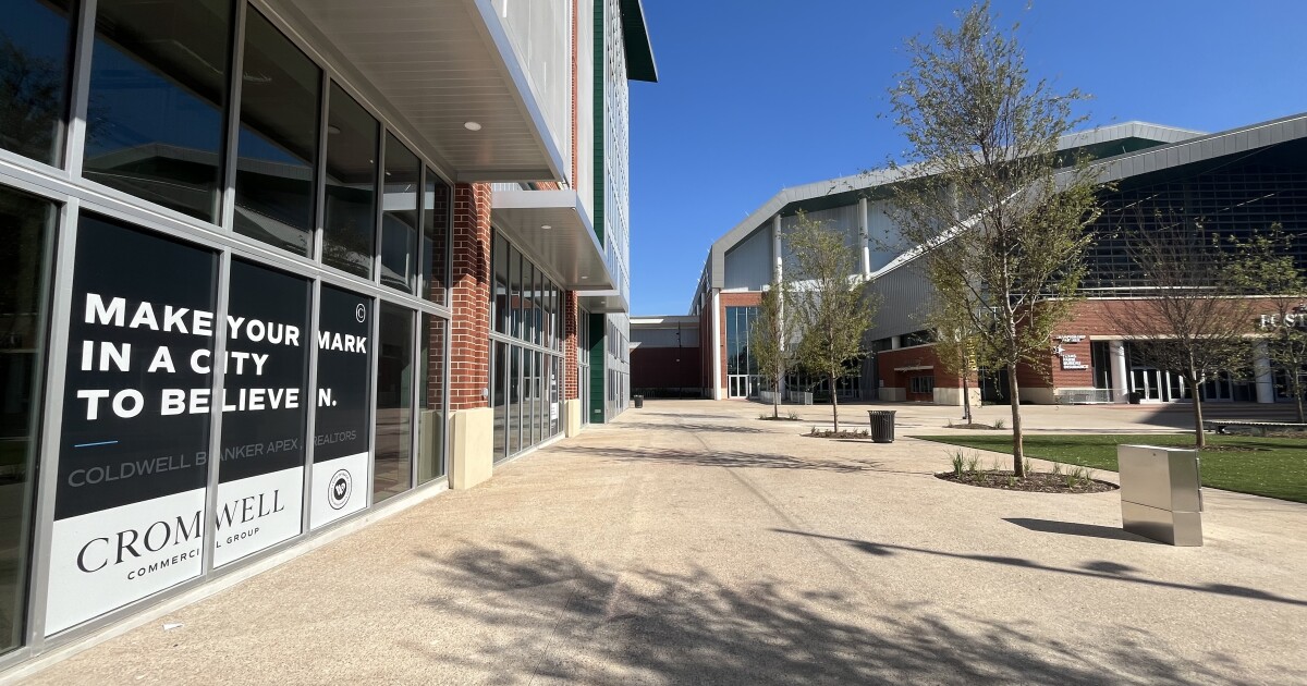 Waco commercial real estate agents view vacant space near Foster Pavilion.