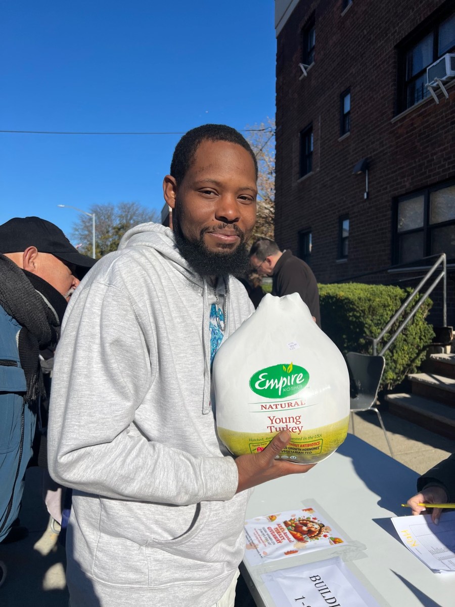 Kew Gardens Hills residents gather for free Thanksgiving turkey distribution event in NYC.