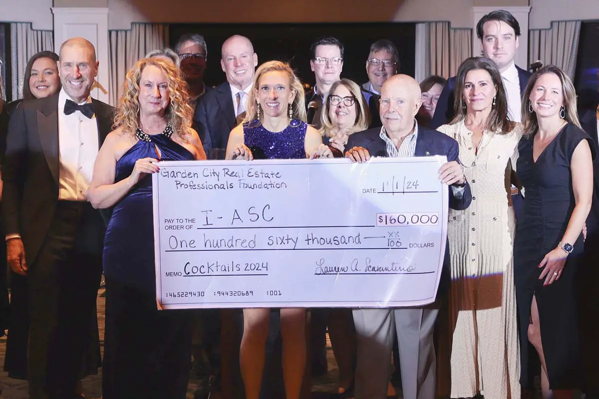 Real estate professionals attend charity gala in support of local community causes.