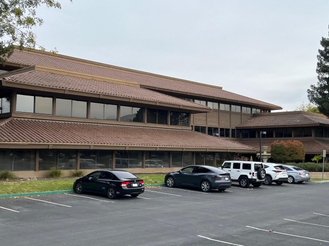 San Jose office building linked to prominent firm enters default status, financial struggles.