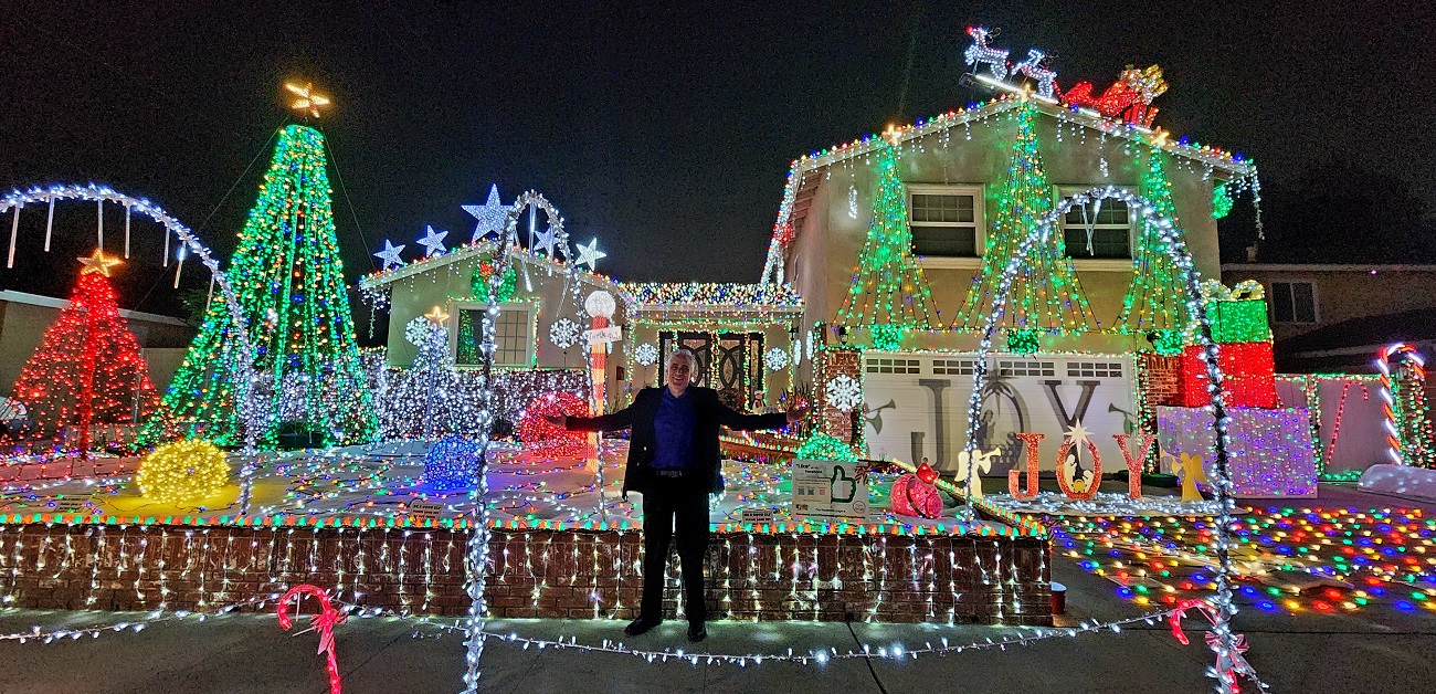 Local business owner's holiday display raises funds for charity with extravagant decorations.