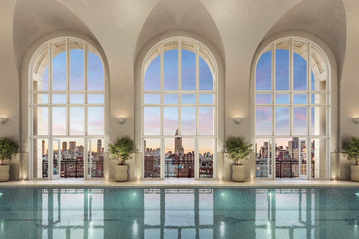 Luxury apartment building in New York City with bustling real estate activity.