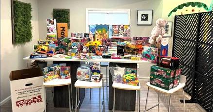 ERA Team VP Realty executive donates Toys for Tots in community.