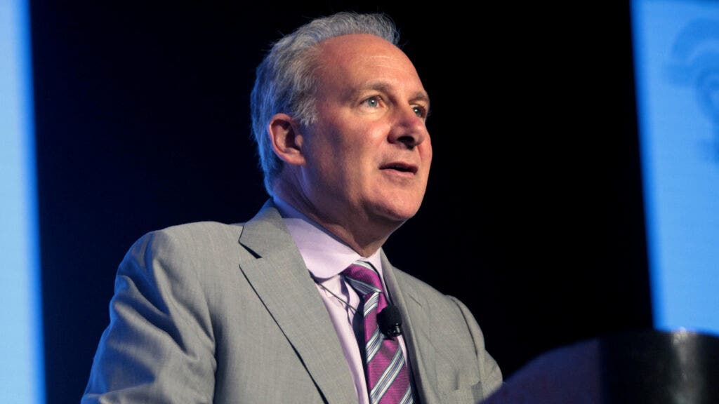 Peter Schiff critiques MicroStrategy's Bitcoin investment strategy at a conference.