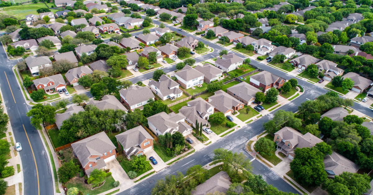 Image: Busy real estate market with rising interest rates, buyers and sellers.