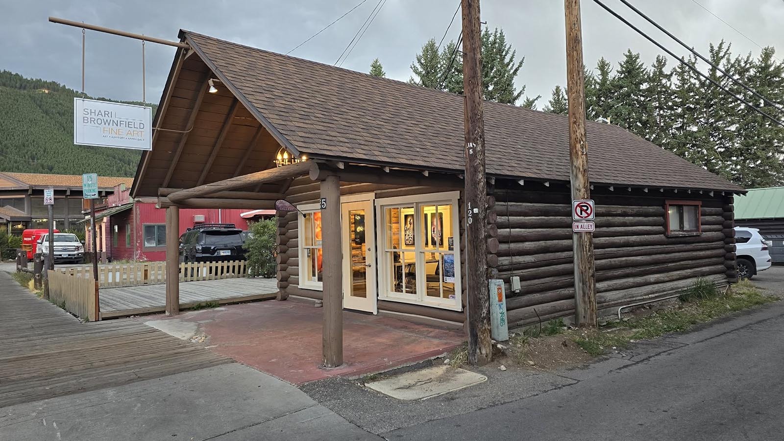 Wyoming cabin amidst booming real estate market with uncertain future ahead.