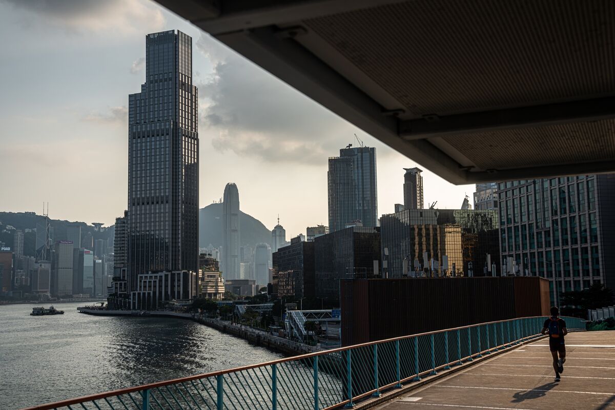 Hong Kong property market collapse, high-rise buildings with empty streets and desperation.