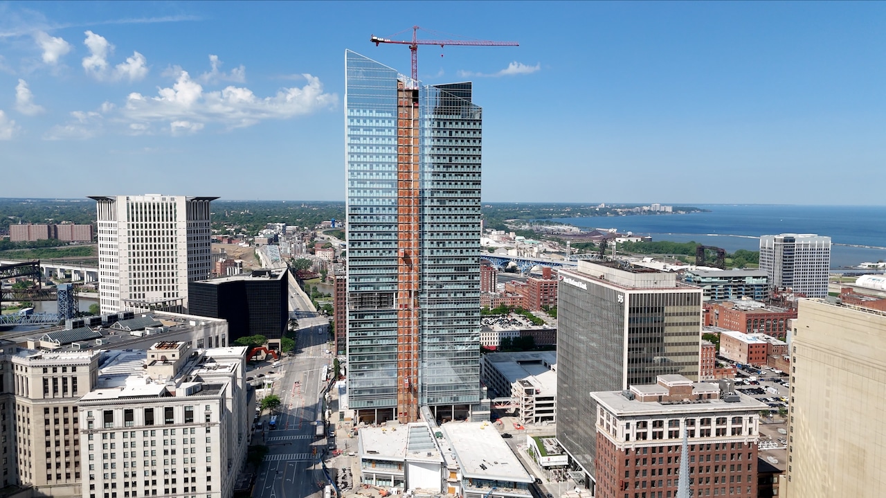 Cleveland skyline with cranes and construction equipment, commercial building boom underway.