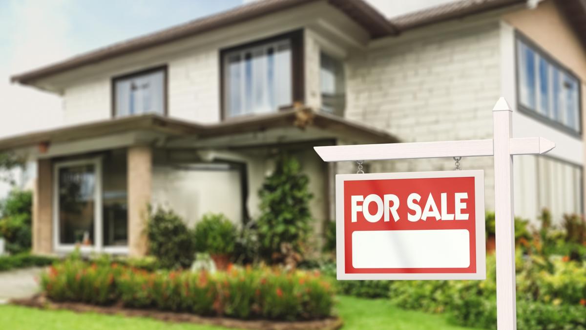 Real estate market warning signs displayed on a calendar with red flags.