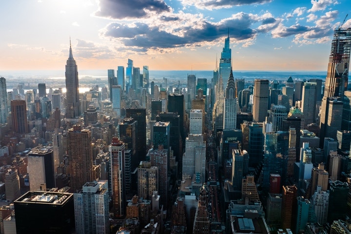 New York City skyline with construction cranes, 82,000 new residential units being developed.