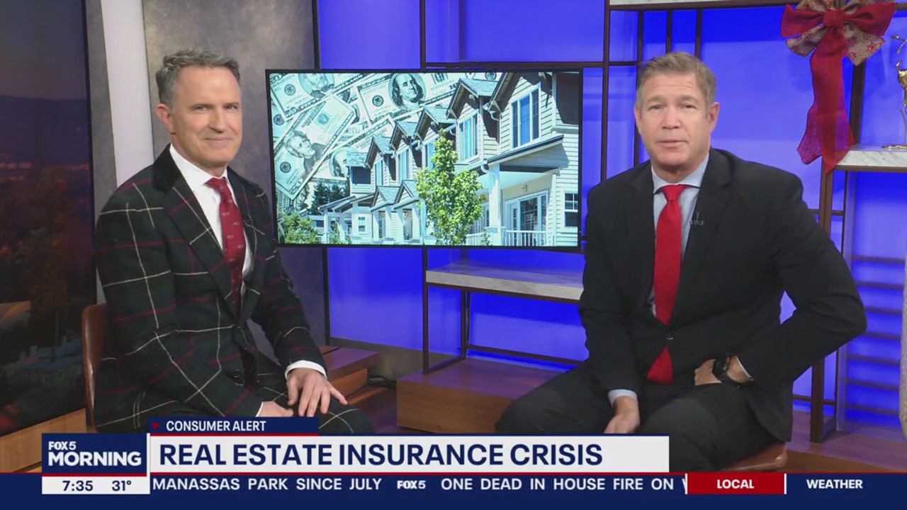 Real estate market affected by insurance crisis, buildings with red warning signs.