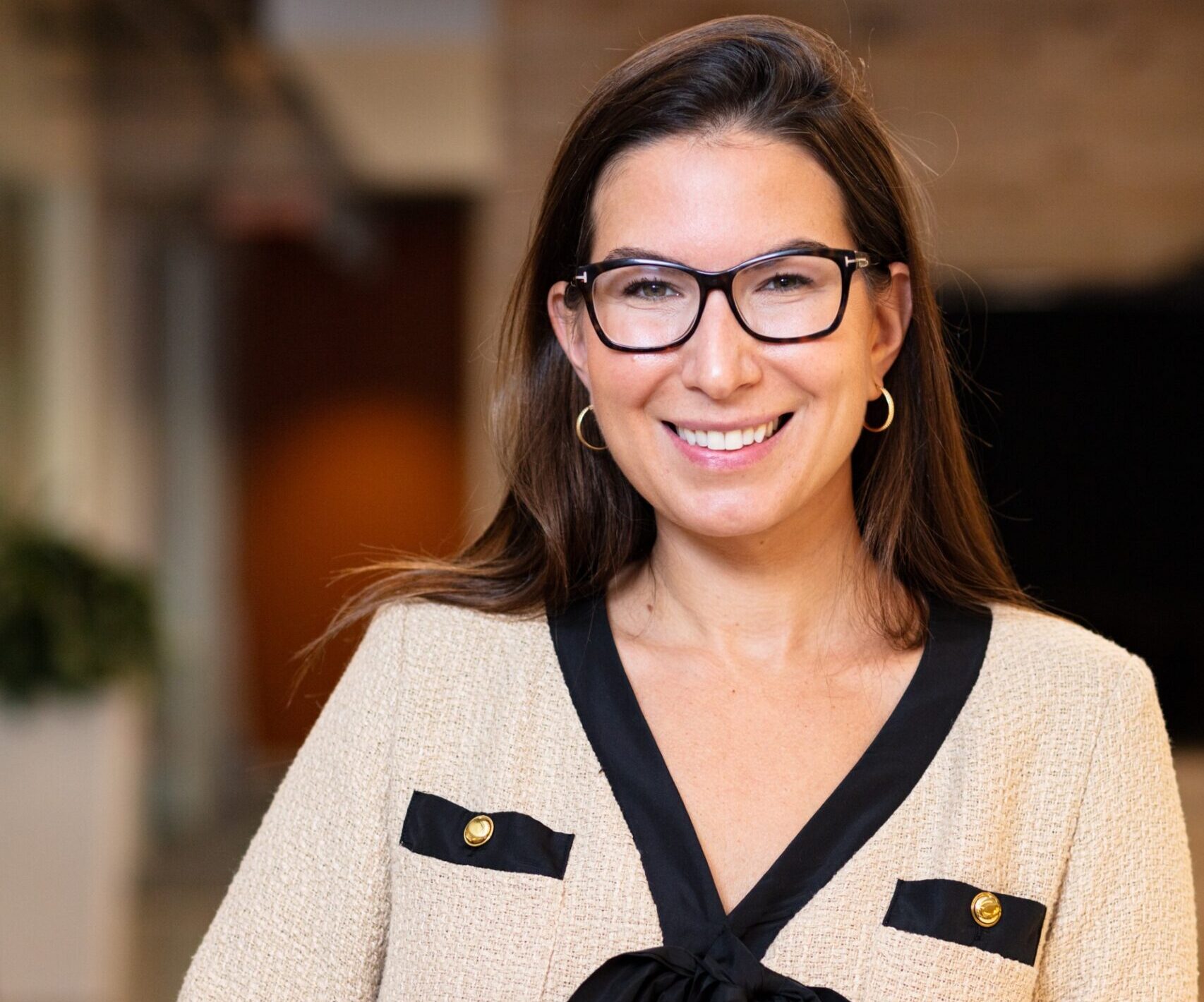 Image: Lauren Michaels, new VP of Marketing at Redgate, smiling in office.