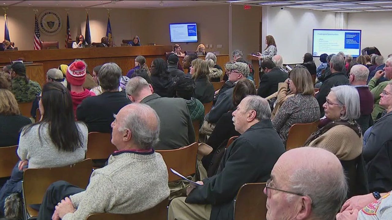 Delaware County residents protest proposed tax hike at town hall meeting.