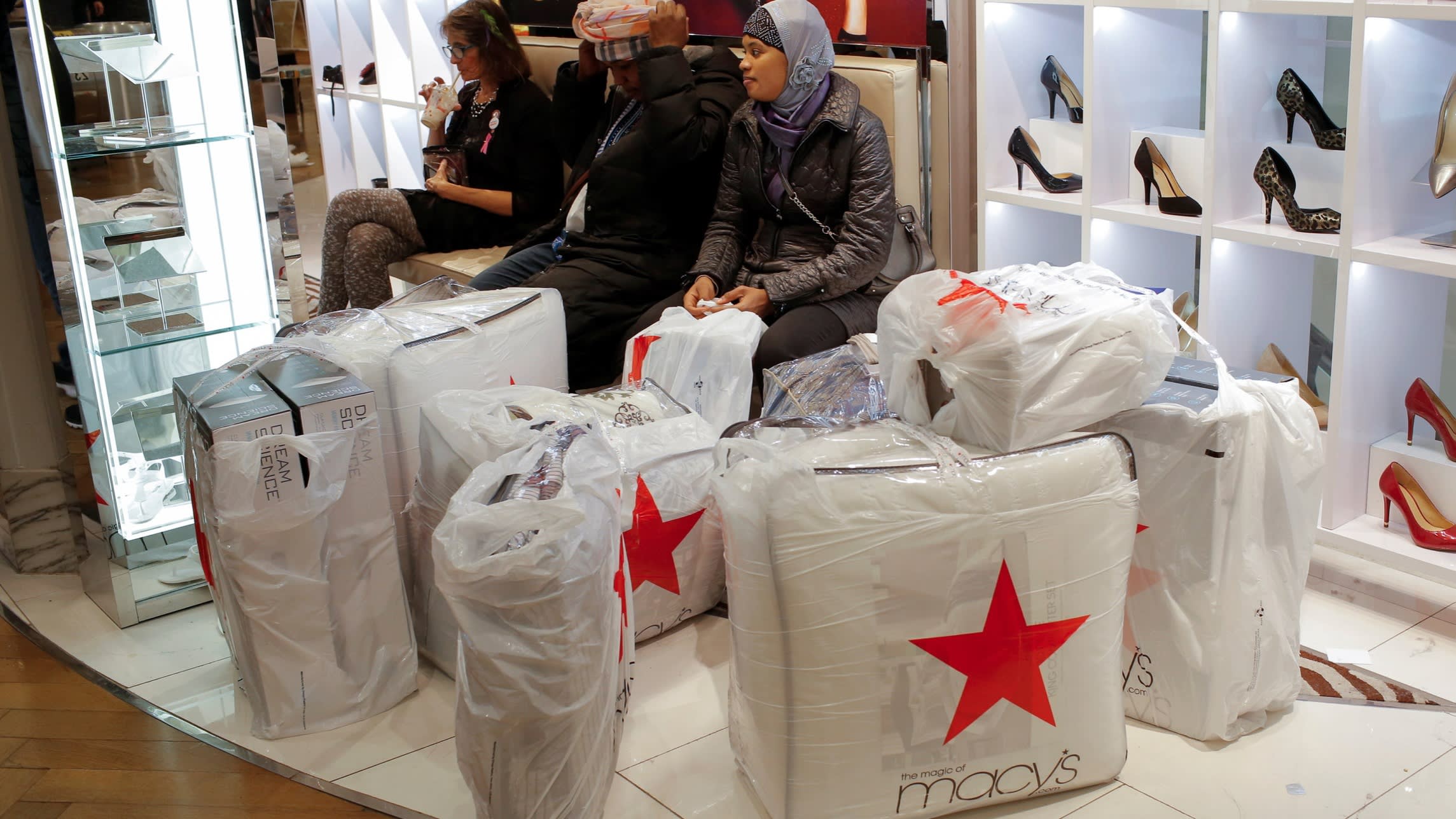 Activists protest outside Macy's headquarters, demand spin-off of property assets.