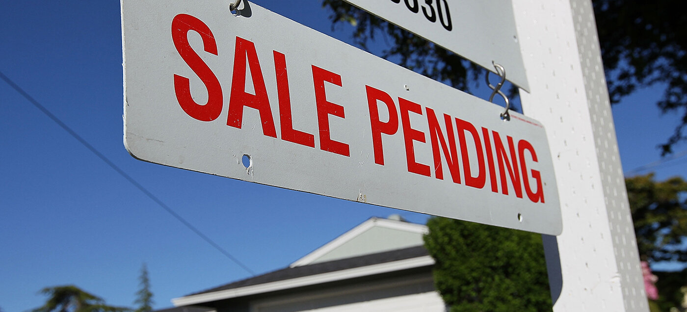 Real estate graph shows pending home sales surge by 5% nationwide.