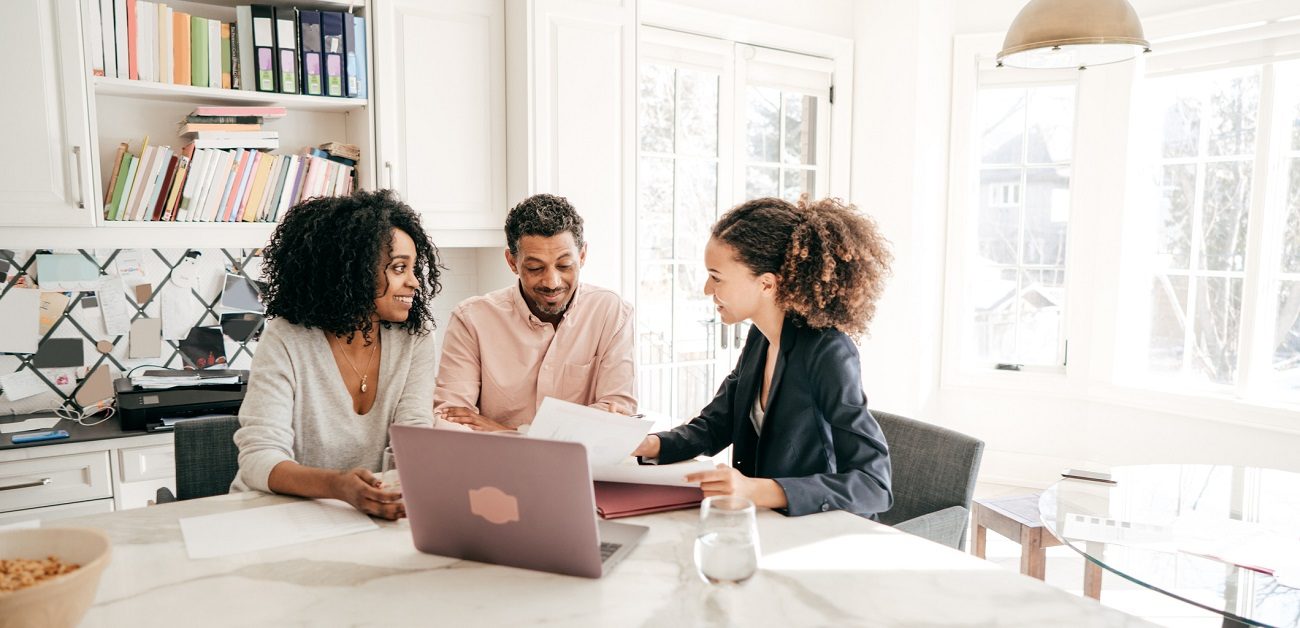 Business professionals considering practice transformation strategies in a modern office setting.