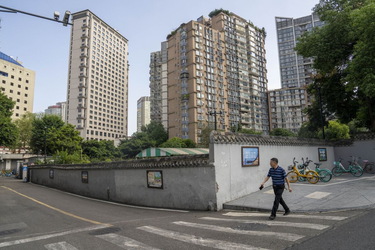 Chinese government officials consider relaxing housing market regulations in major cities.