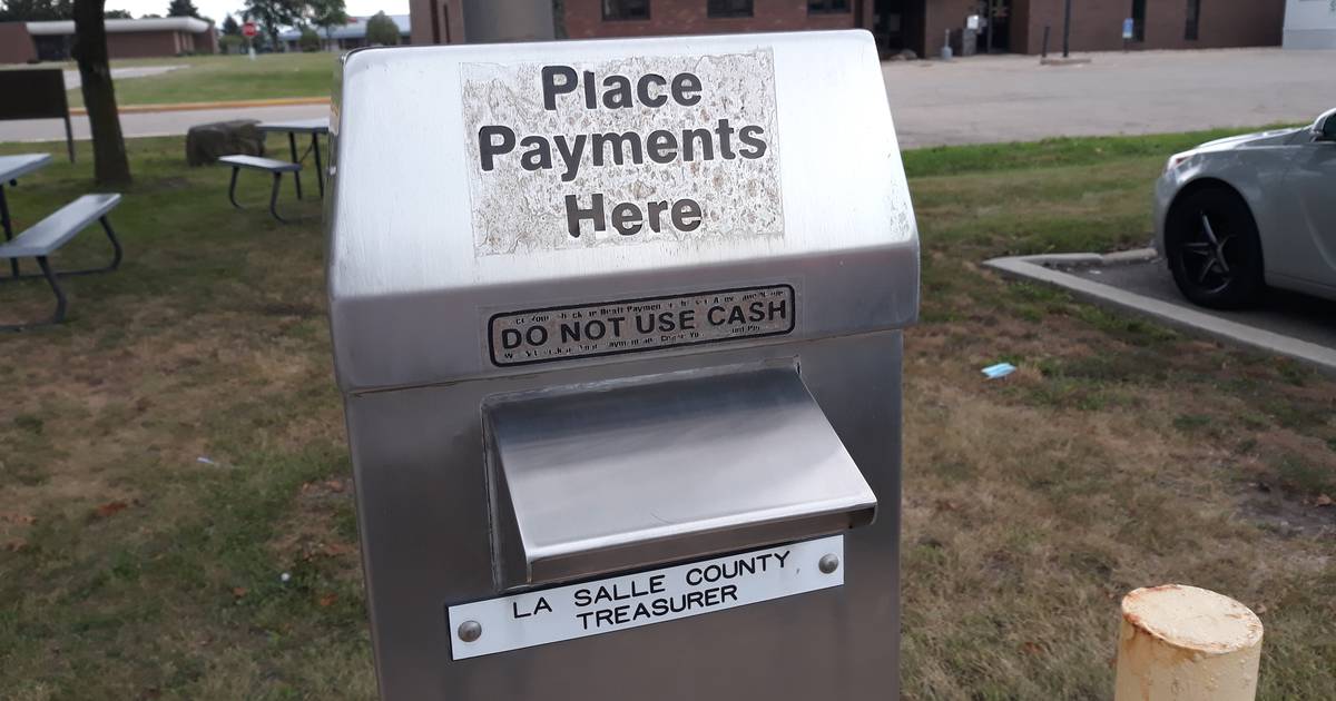 LaSalle County residents gather near tax offices with financial documents in hand.