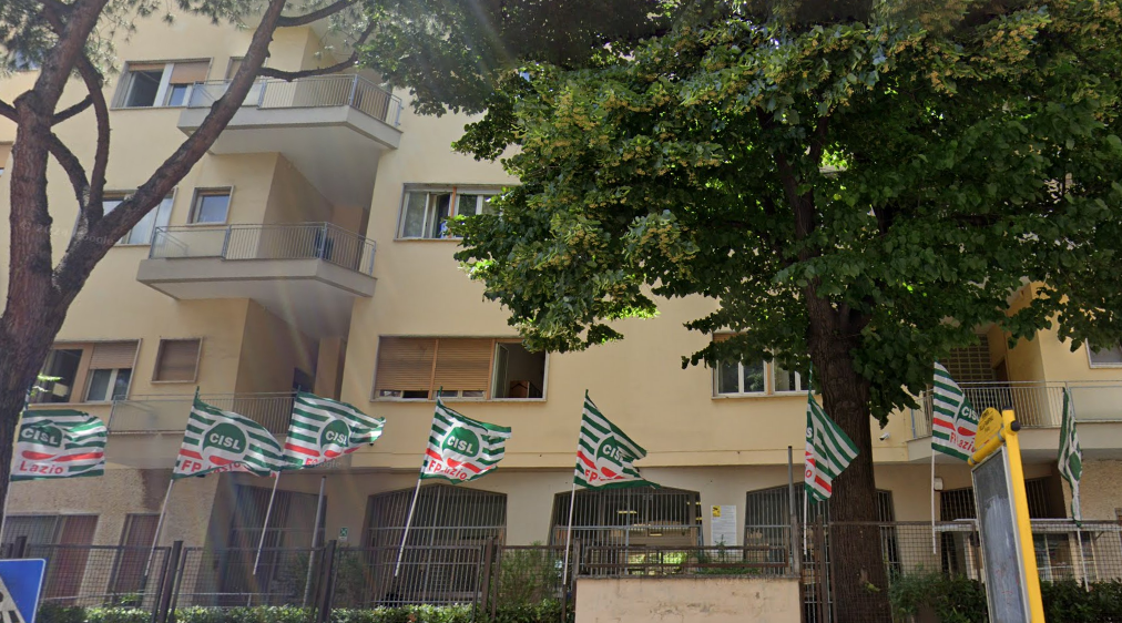 Vatican officials stand in front of Italian property holdings amidst healthcare funding controversy.