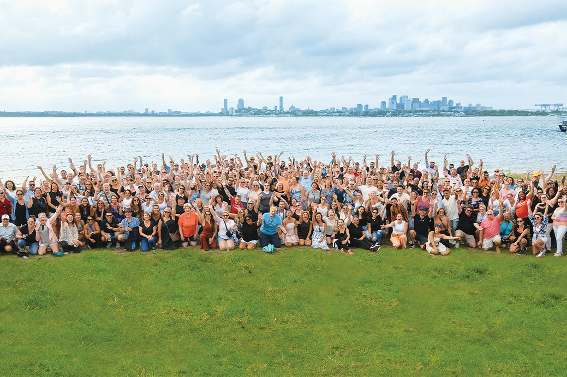 Anthony Lamacchia, realtor turned industry leader, standing in front of Boston cityscape.