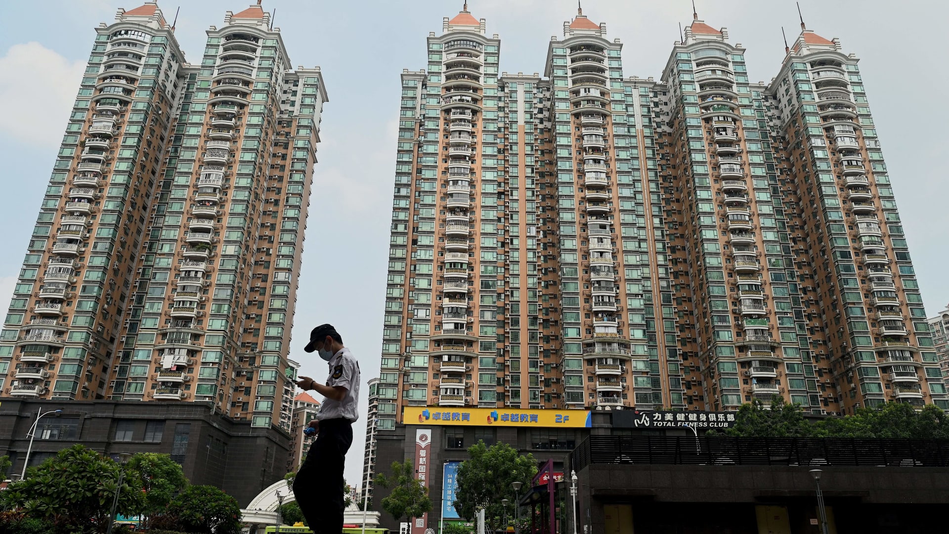 Chinese real estate shares rise in Shanghai and Beijing after rule relaxation.