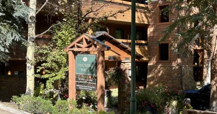 Image of Aspen market data charts with Colorado mountain backdrop.