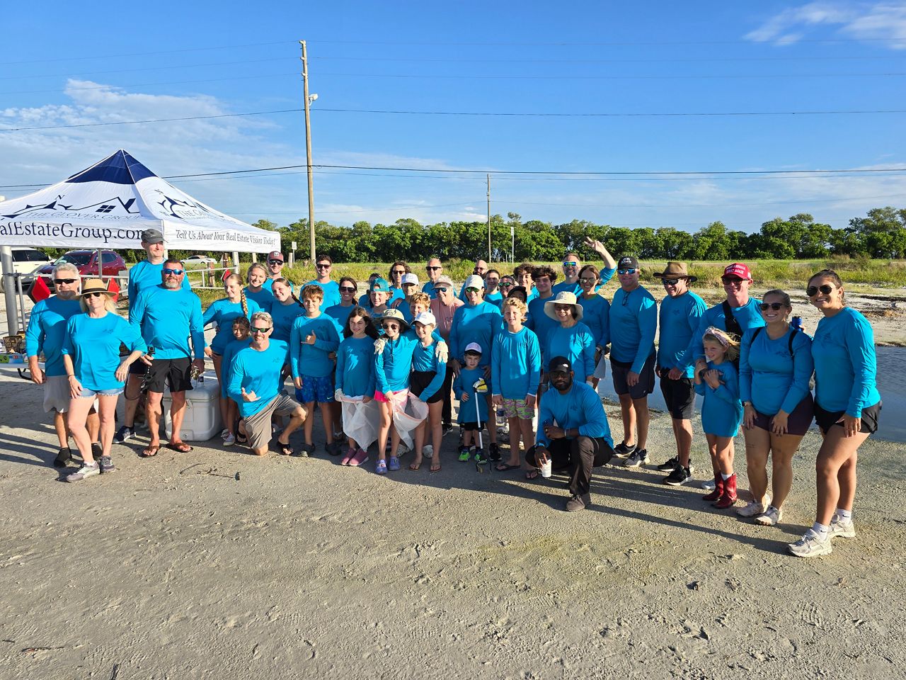 Volunteers from St. Pete real estate group clean up Gandy Beach shoreline annually.