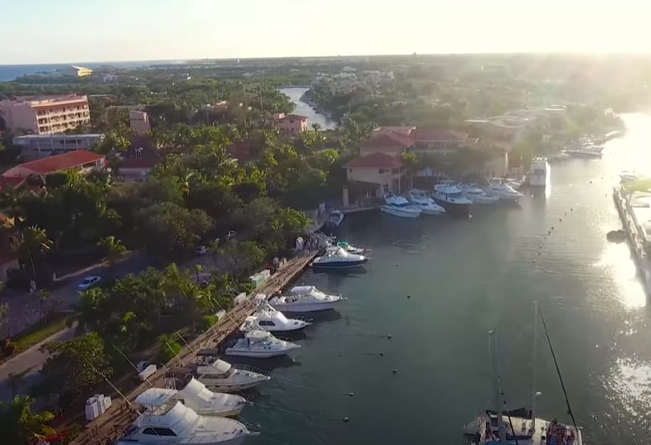 Construction equipment at Puerto Aventuras Caleta Maya real estate project site in Mexico.