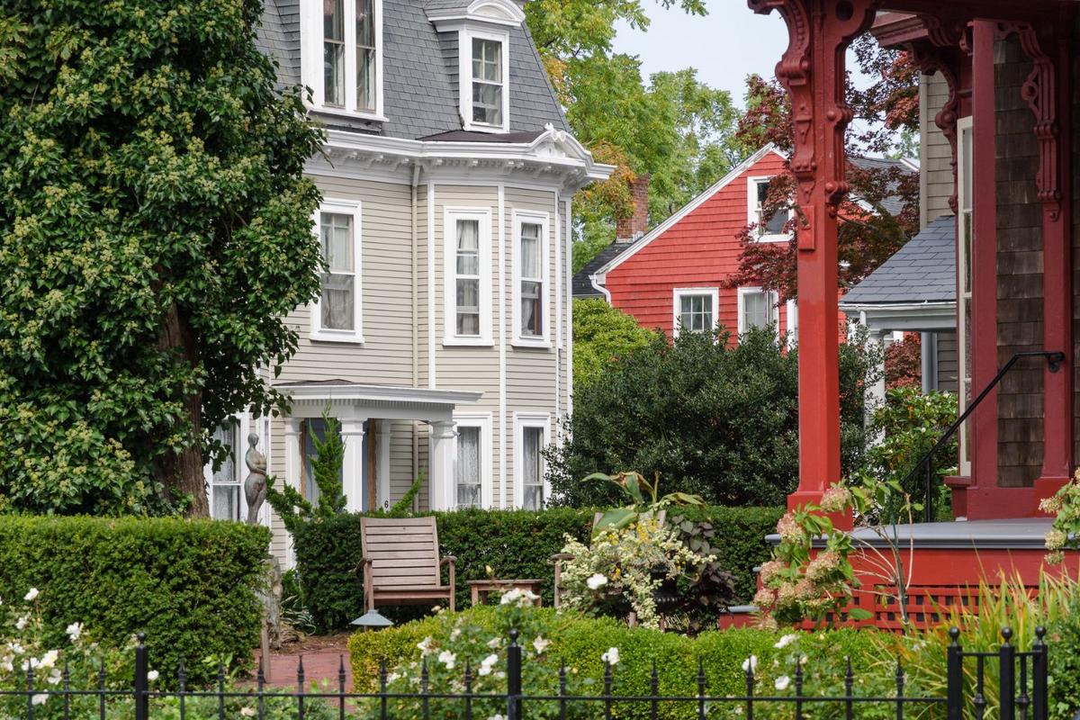 Real estate agents in Connecticut stand amidst thriving market landscape.