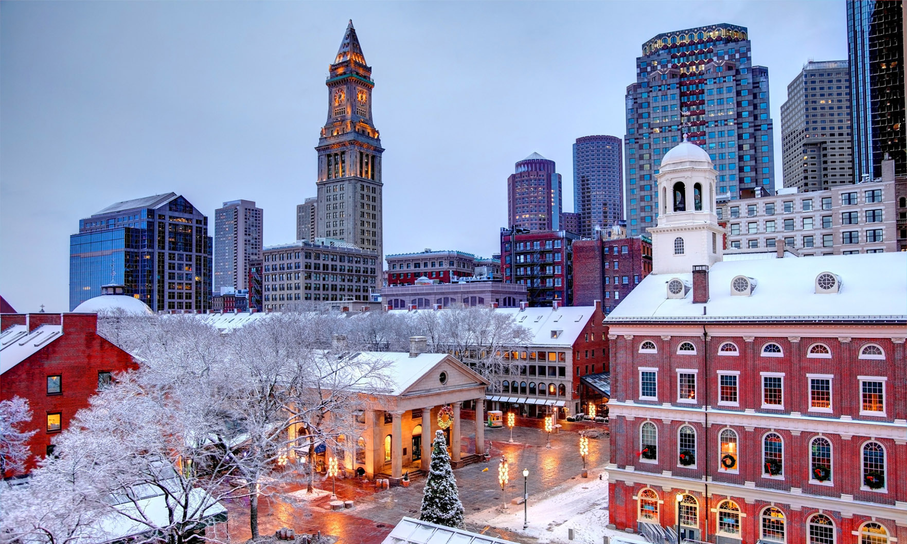 Boston skyline with construction cranes, highlighting city's thriving real estate market.