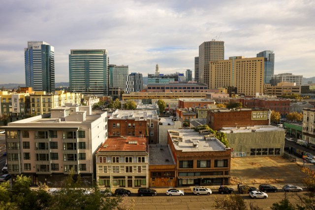 Oakland office buildings with high vacancy rates amidst falling property values.