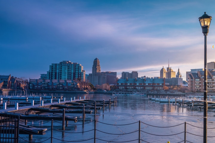 Buffalo, New York cityscape with snow-covered buildings and bustling downtown area.