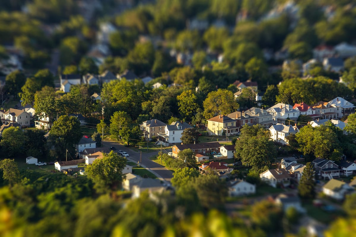 Local officials' homes experience substantial property value increases in affluent neighborhood.