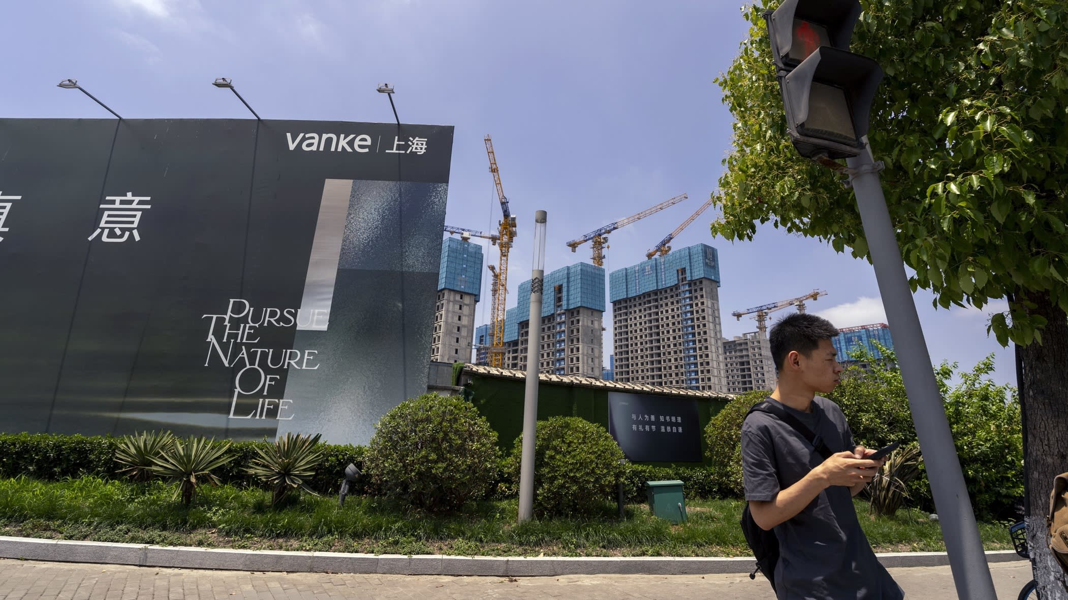 China's Vanke property company struggles amidst uncertainty in Beijing real estate market.