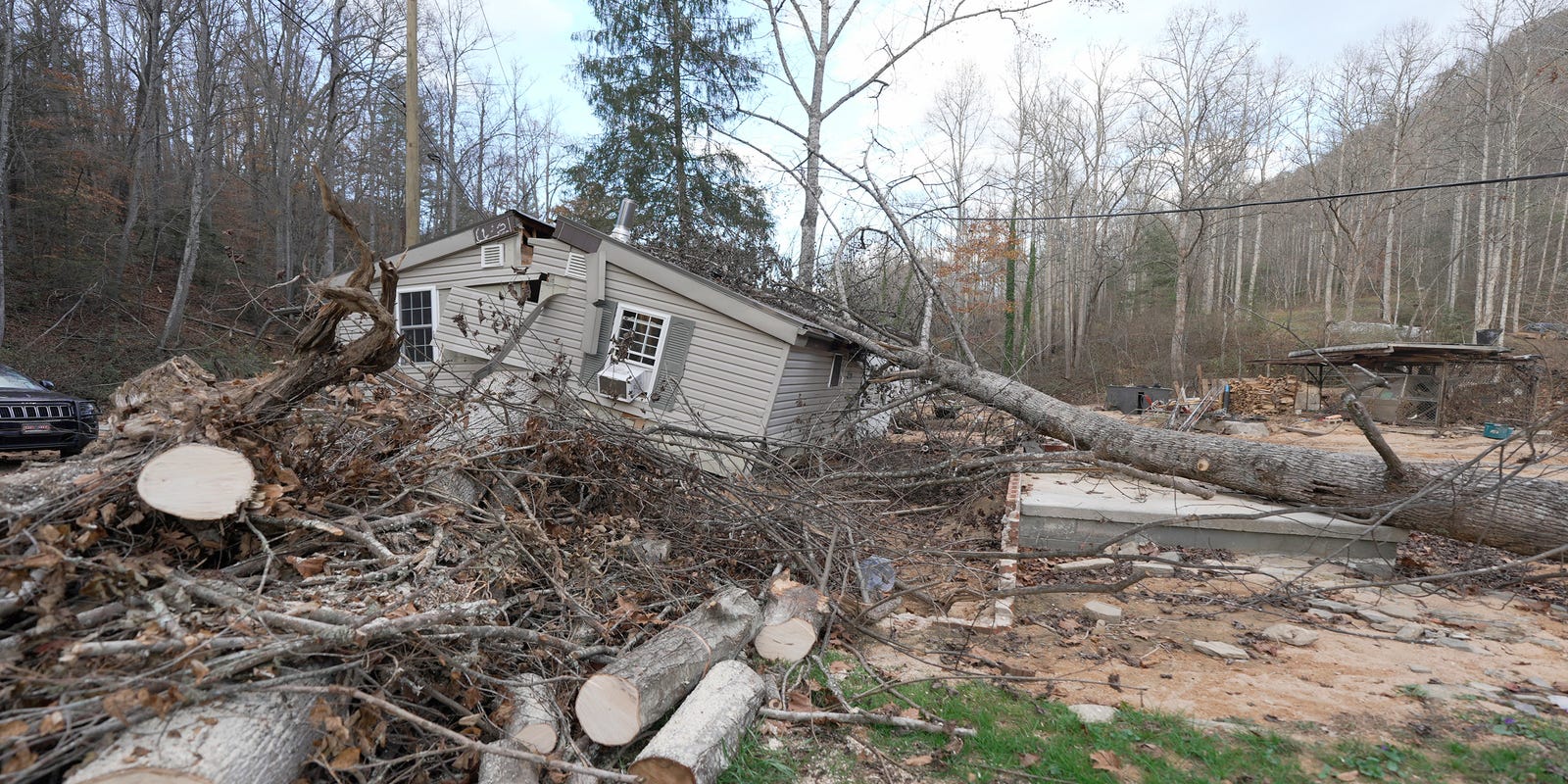 Henderson County homes damaged by Tropical Storm Helene's flooding aftermath.