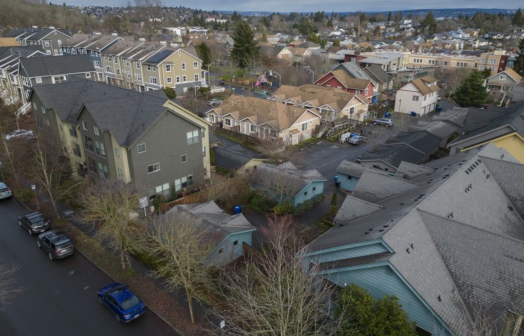 Seattle-area homes sit unsold amidst high prices and sluggish market activity.