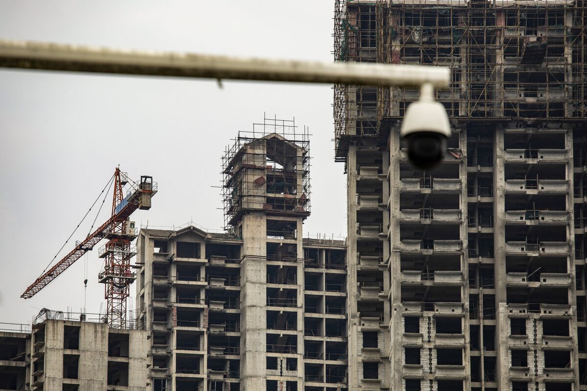 China property sector crisis: skyscrapers in Shanghai risk widespread defaults.