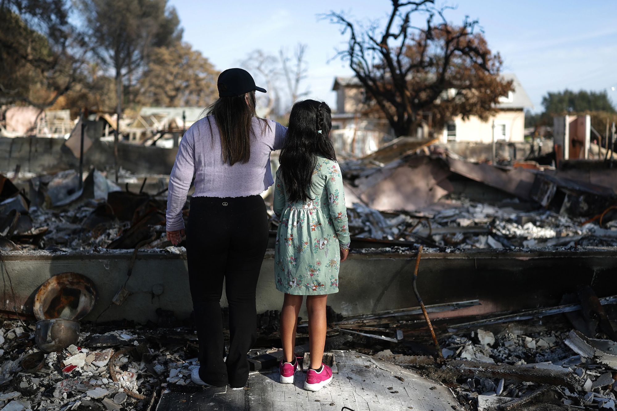 California wildfire survivors flee to nearby metropolitan areas for safety and refuge.