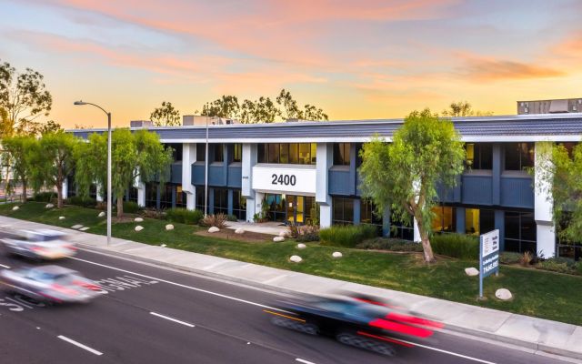 Irvine, California: New affordable apartment complex with modern architecture and lush landscaping.