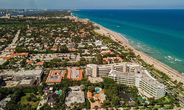 Beach town residents and migrants gather amidst housing construction in coastal community.