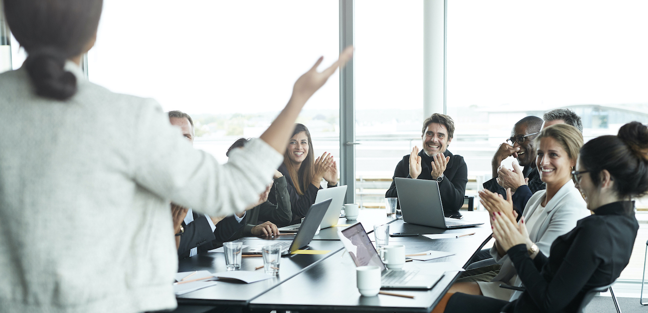 Business professionals shaking hands, symbolizing partnership and transformed broker relationships globally.