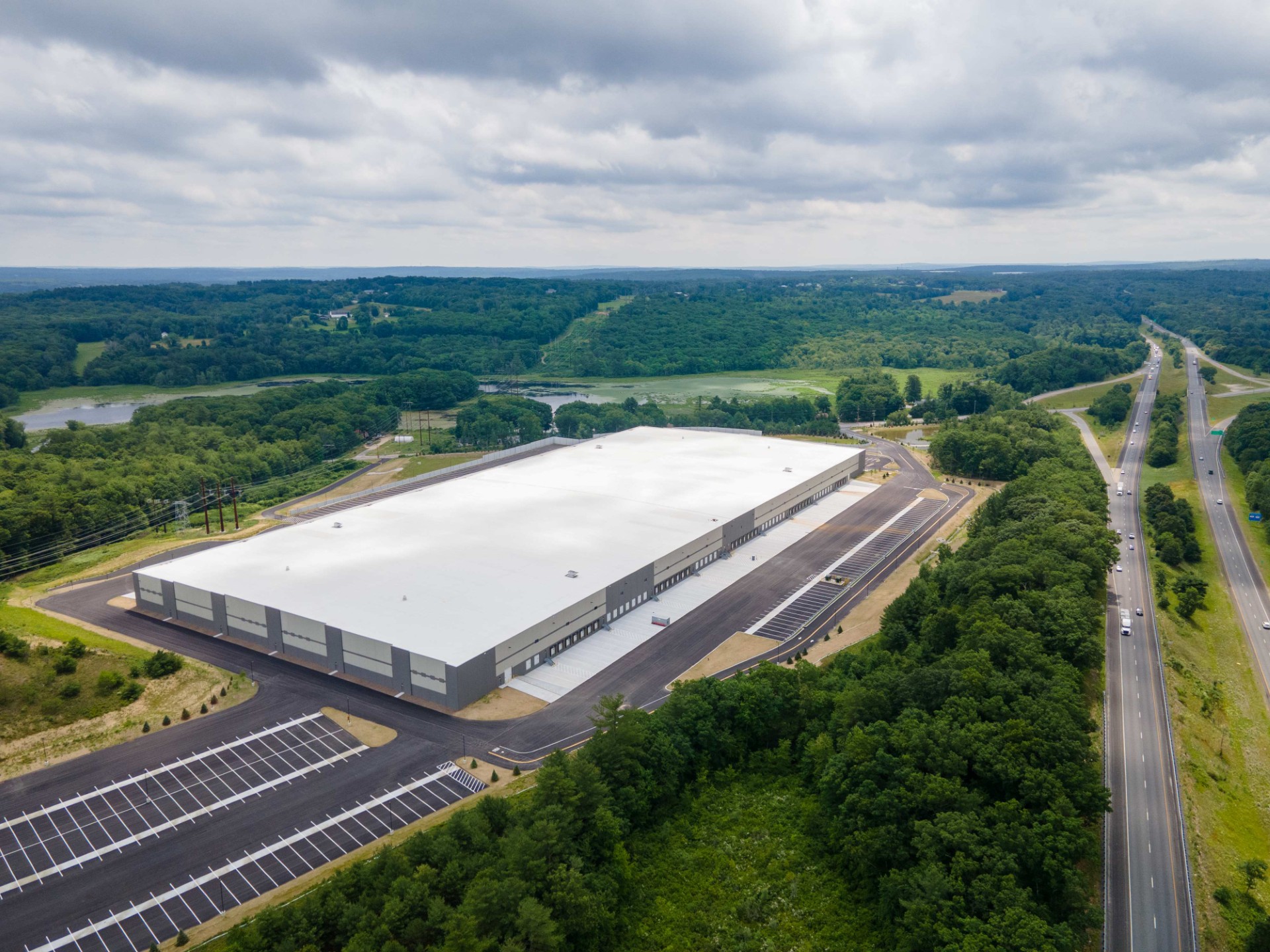 Massachusetts industrial portfolio expands with $120M Uxbridge acquisition and development plans.